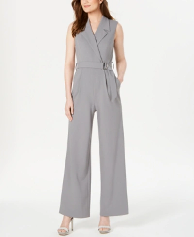 Shop Calvin Klein Belted Wrap Jumpsuit In Tin Gray