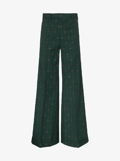 Shop Gucci Pinstripe Logo Wool Flared Trousers In Green