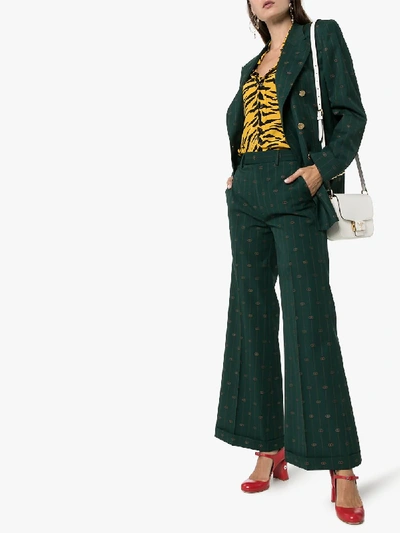 Shop Gucci Pinstripe Logo Wool Flared Trousers In Green