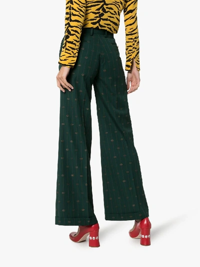 Shop Gucci Pinstripe Logo Wool Flared Trousers In Green