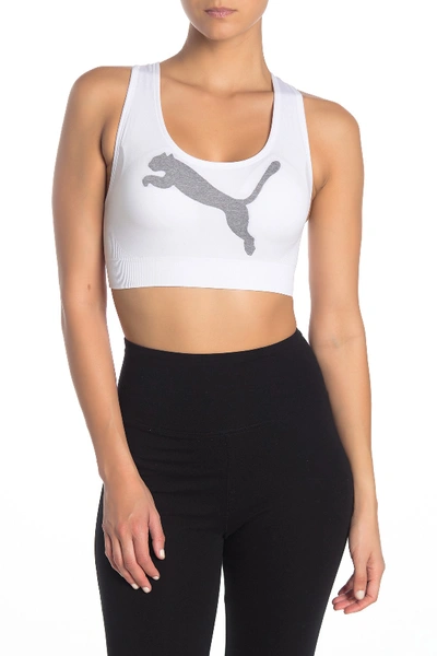 Shop Puma Seamless Graphic Logo Crossback Sports Bra In White Traditional