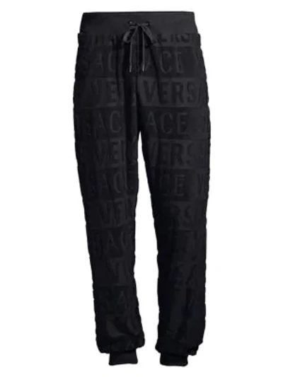 Shop Versace Tuta Logo Joggers In Black