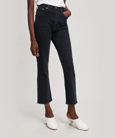 Shop Agolde Pinch Waist High-rise Kick Flare Jeans In Realm Black