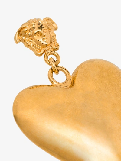 Shop Versace Gold Tone Tribute Heart Drop Earrings In Metallic