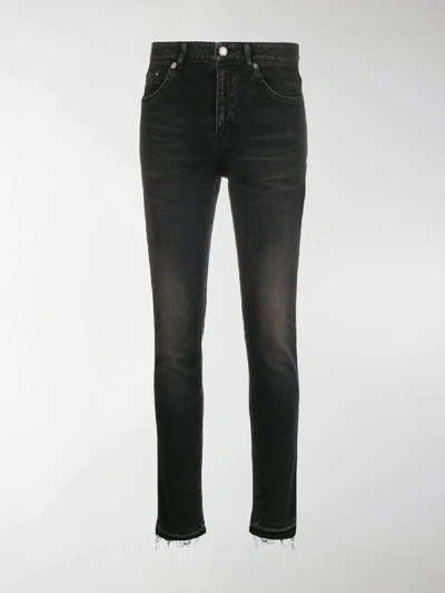 Shop Saint Laurent Stonewashed Skinny Jeans In Black