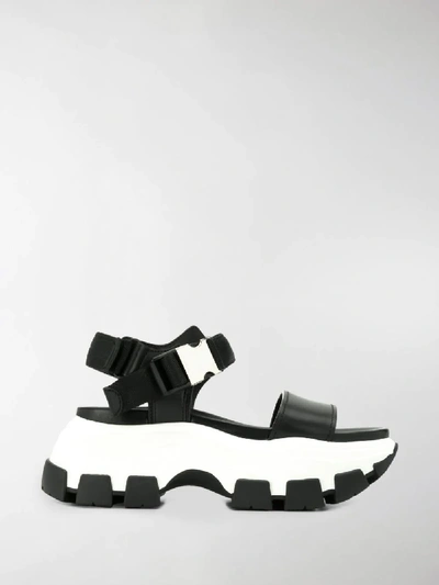 Shop Prada Pegasus Strap Sandals In Black