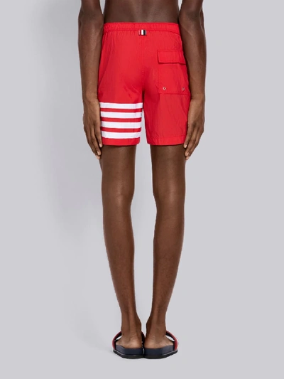Shop Thom Browne Snap Front Swim Short In Solid Swim Tech W/ 4 Bar Print In Red