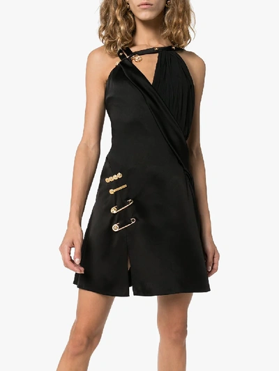 Shop Versace Asymmetric Safety Pin Mini Dress In Black