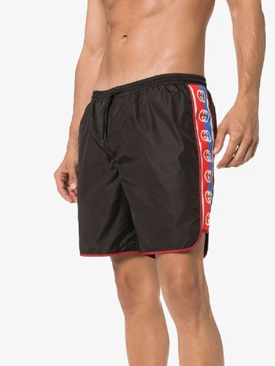 Shop Gucci Gg Logo Stripe Swim Shorts In Black