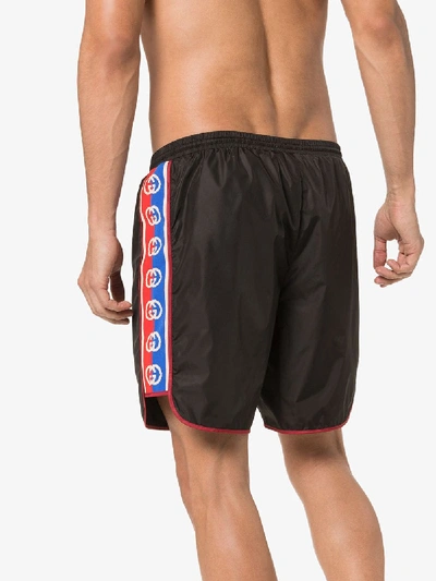 Shop Gucci Gg Logo Stripe Swim Shorts In Black