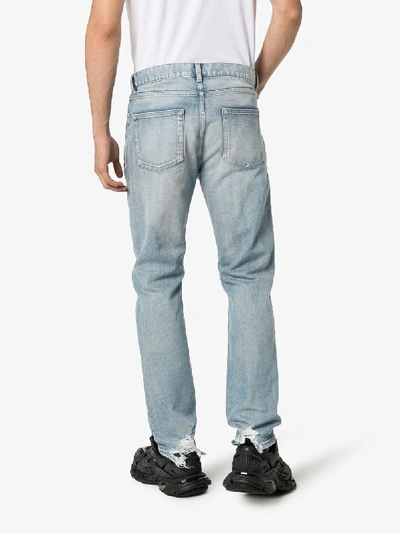 Shop Saint Laurent Straight Leg Frayed Hem Jeans In Blue