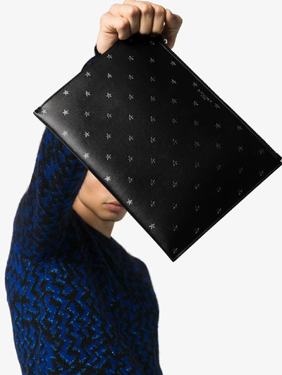 Shop Saint Laurent Black Star Print Leather Pouch Bag