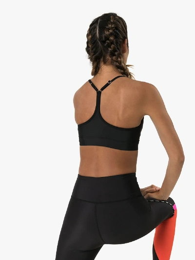 Shop P.e Nation Training Day Logo Sports Bra In Black