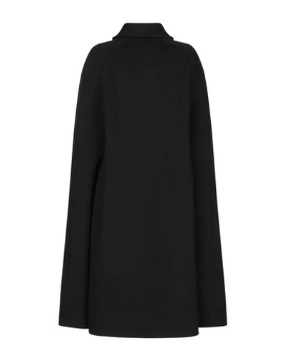 Shop Burberry Cape In Black