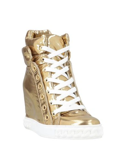 Shop Casadei Sneakers In Gold