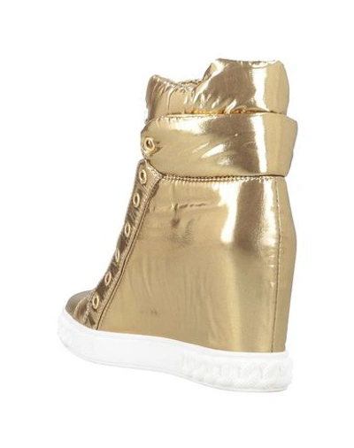 Shop Casadei Sneakers In Gold
