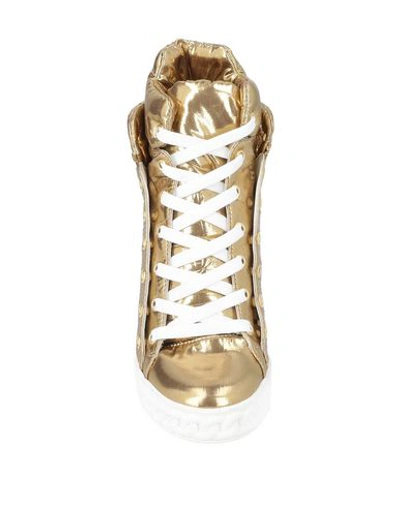 Shop Casadei Sneakers In Gold
