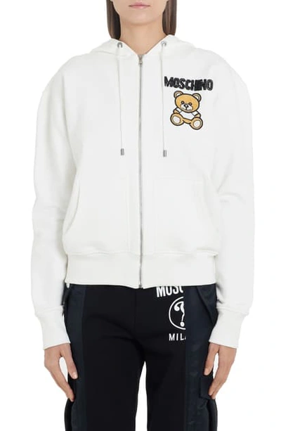 Shop Moschino Embellished Teddy Zip Hoodie In White