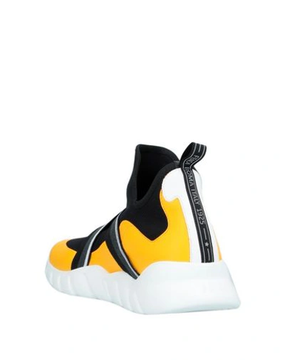 Shop Fendi Sneakers In Yellow