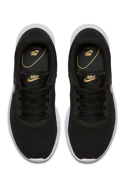 Shop Nike Tanjun Sneaker In 004 Black/m Gold