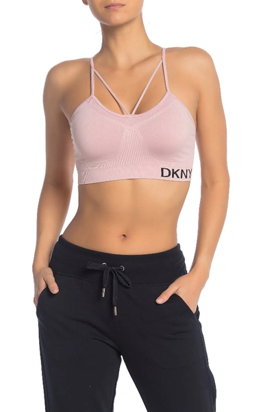 Shop Dkny Low Impact Strappy Sports Bra In Mulberry