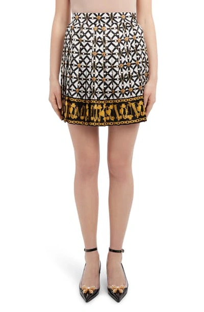 Shop Versace Harness Print Pleated Silk Miniskirt In Black White