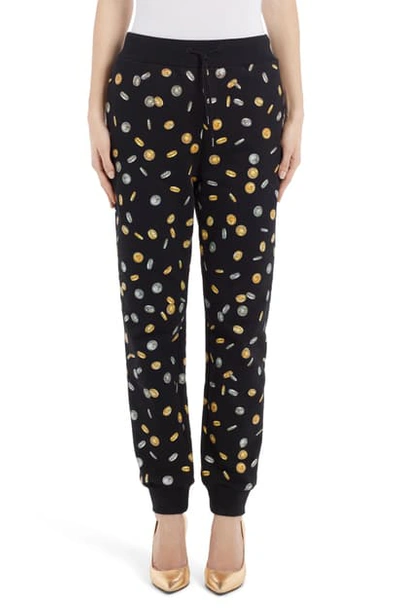 Shop Moschino Coin Print Joggers In Black
