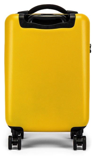 Shop Herschel Supply Co. Trade Carry On Suitcase In Yellow. In Nugget Gold