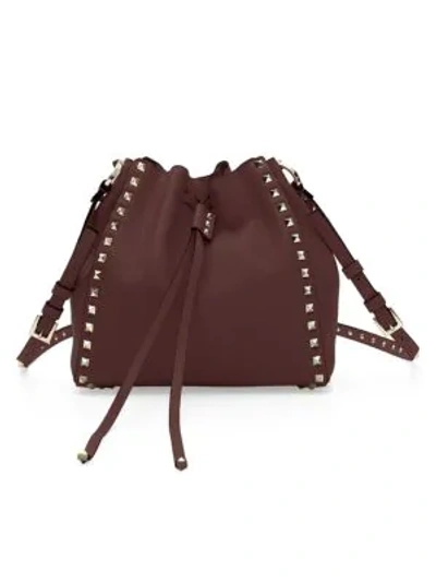 Shop Valentino Garavani Small Rockstud Leather Bucket Bag In Rubin