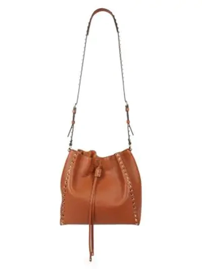 Shop Valentino Garavani Rockstud Leather Bucket Bag In Tan