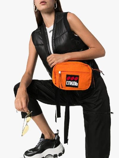 Shop Heron Preston Orange Ctnmb Cross Body Camera Bag