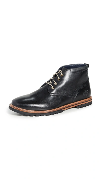 Shop Cole Haan Raymond Grand Chukka Boots In Black Handstain