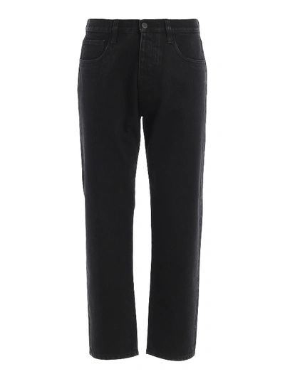 Shop Prada Logo Detailed Dark Wash Jeans In Black