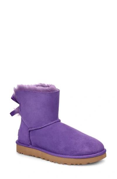 Shop Ugg Mini Bailey Bow Ii Genuine Shearling Bootie In Violet Bloom Suede