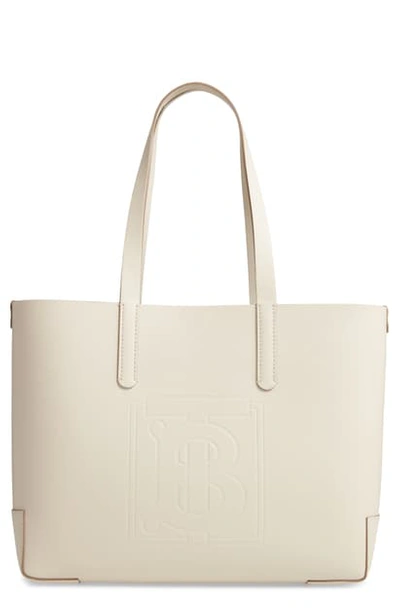 Shop Burberry Embossed Monogram Leather Tote In Limestone