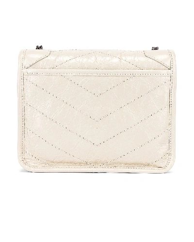 YSL Niki MM Distressed leather in cream, Luxury, Bags & Wallets on