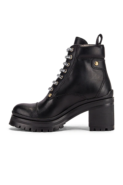 Shop Miu Miu Lace Up Leather Ankle Boots In Black