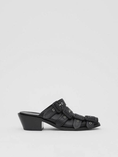 Shop Burberry Buckled Leather Peep-toe Mules In Black