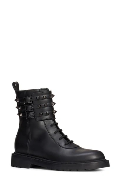 Shop Valentino Rockstud Buckle Combat Boot In Black