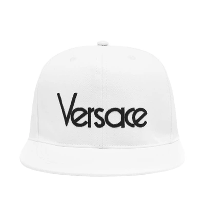 Shop Versace Embroidered Logo Baseball Cap In White