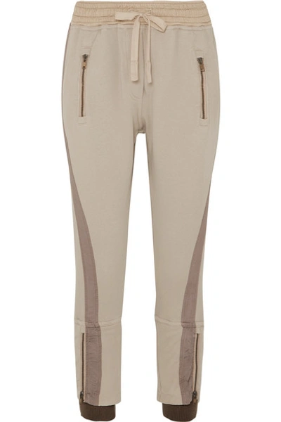 Shop Haider Ackermann Cropped Paneled Cotton-jersey Tapered Track Pants In Beige