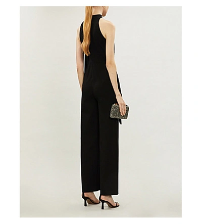 Shop Stella Mccartney Fringe-trimmed Halterneck Crepe Jumpsuit In Black