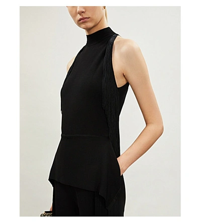 Shop Stella Mccartney Fringe-trimmed Halterneck Crepe Jumpsuit In Black