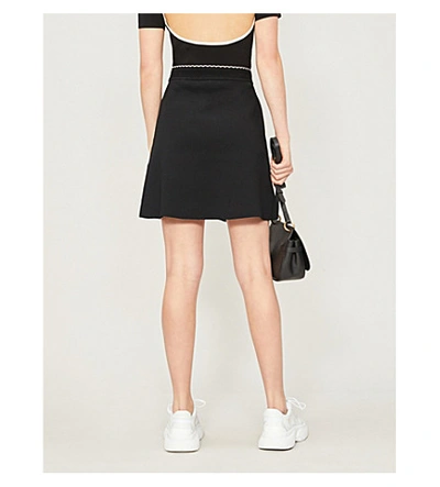 Shop Sandro A-line Stretch-knit Skirt In Black