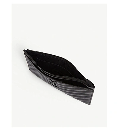Shop Saint Laurent Monogram Quilted Leather Pouch In Black Black