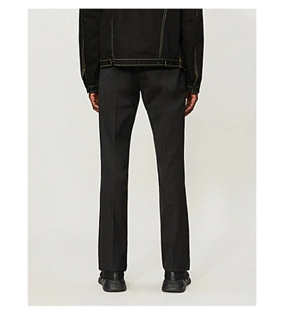Shop Fendi Logo-print Slim-fit Straight Woven Trousers In Black