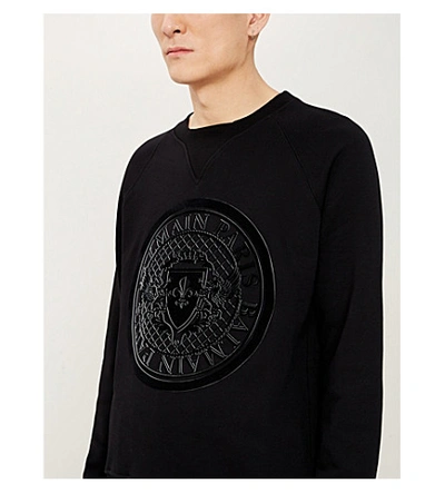 Shop Balmain Logo-flocked Cotton-jersey Sweatshirt In Black