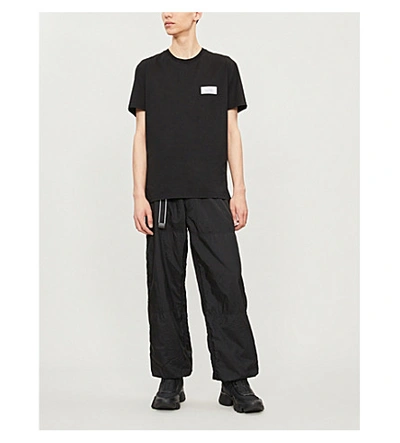 Shop Givenchy Atelier-patch Cotton-jersey T-shirt In Black