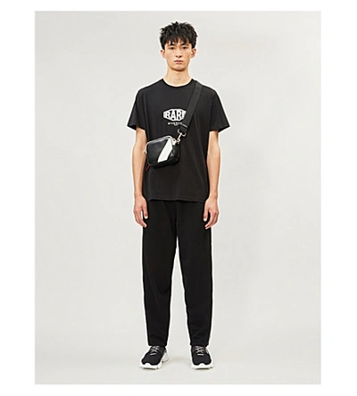 Shop Givenchy Logo-tape Cotton-jersey Jogging Bottoms In Black