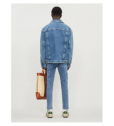 Shop Gucci Appliquéd Faded Denim Jacket In Blue Multi